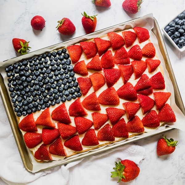 This American Flag Fruit Pizza is a festive dessert to bring to your next gathering! It's light, fresh and seriously easy to throw together.