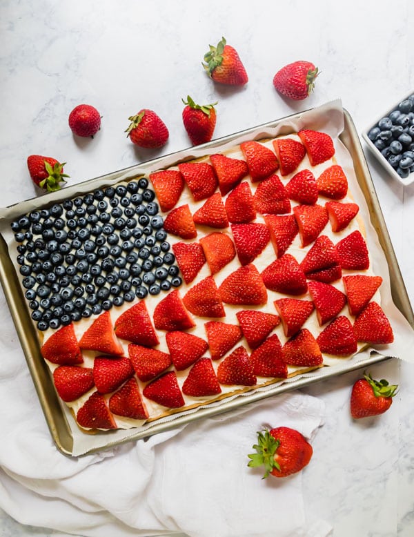 An overhead image of a whole American Flag fruit pizza.
