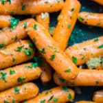 Cooked carrots don't have to be sugary sweet! Try these easy Garlic Butter Carrots. They're sautéed with a savory mix of butter and garlic and finished with fresh parsley for a simple side dish that's sure to please!
