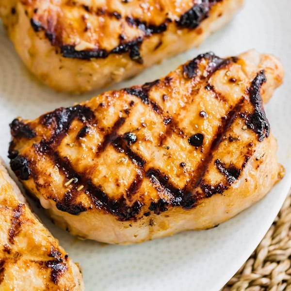 This Maple Dijon Grilled Pork Chop Marinade is so full of savory, delicious flavor, it'll be on repeat for the entire summer! It's easy to throw together and freeze or cook right away!