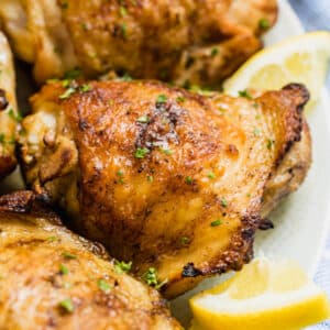 Easy Grilled Chicken Thighs are your simple summer dinner solution! With simple marinade made with just 3 ingredients it's a delicious dinner that's sure to please!