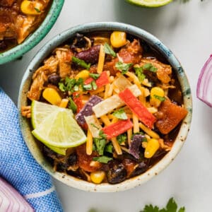 Make this crazy easy Chicken Chili made in the Instant Pot or Crock Pot and prepare to wow your family! Tender shredded chicken, delicious vegetables and a ton of fantastic flavor makes this your go-to dish to warm you right up.