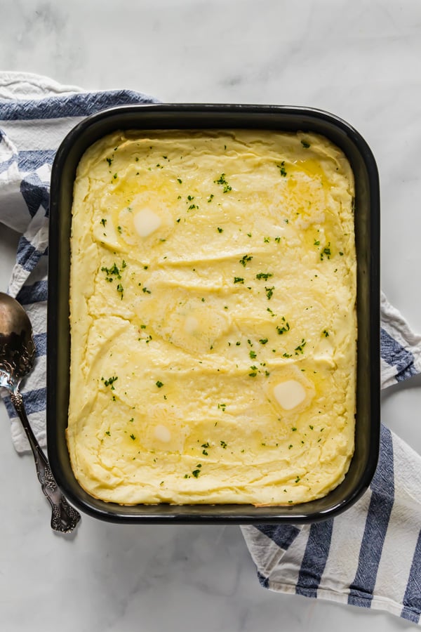 An overhead image of a pan of make ahead mashed potatoes.