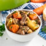 This Irish Guinness Lamb Stew is the most deliciously cozy dinner! It's an easy recipe that includes fall-apart-tender chunks of lamb meat, plenty of vegetables and a flavorful gravy that's so good you'll want to sop up every last drop with a piece of crusty bread! This can also be made in the crockpot or instant pot!