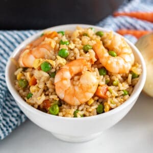 Shrimp Fried Rice is a quick and easy weeknight dinner option. This delicious Chinese-inspired stir fry recipe is a great, healthy way to repurpose leftover rice and is so simple, it'll quickly become a staple in your recipe rotation.