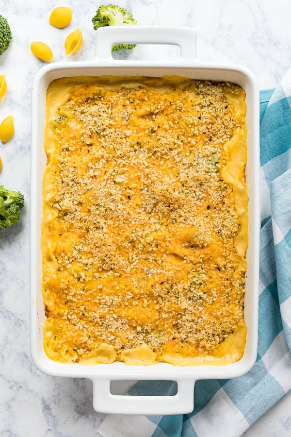 An overhead image of a pan of macaroni and cheese with broccoli.