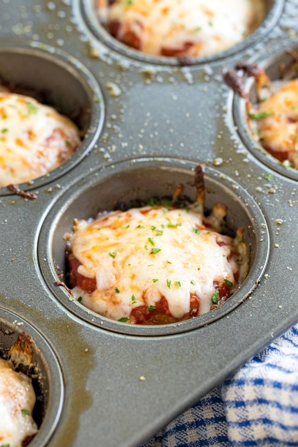 A meatloaf muffin still in the muffin tin.