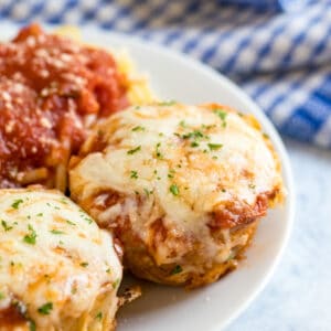 These easy Chicken Parmesan Meatloaf Muffins have all the great flavors of a classic Chicken Parmesan recipe, but they come together much quicker. It's an Italian twist on classic meatloaf and is the perfect 30 minute meal for busy weeknights!