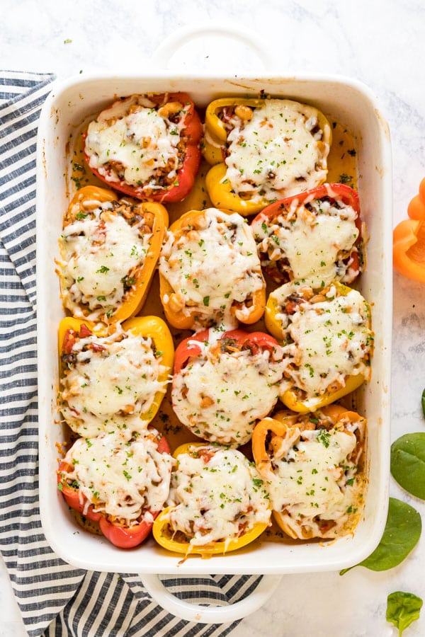An overhead image of a pan of vegetarian stuffed peppers.