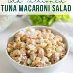 A white bowl full of classic tuna macaroni salad.