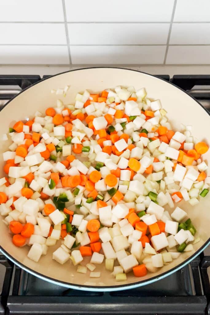 Vegetables in a pan on the stove sautéing