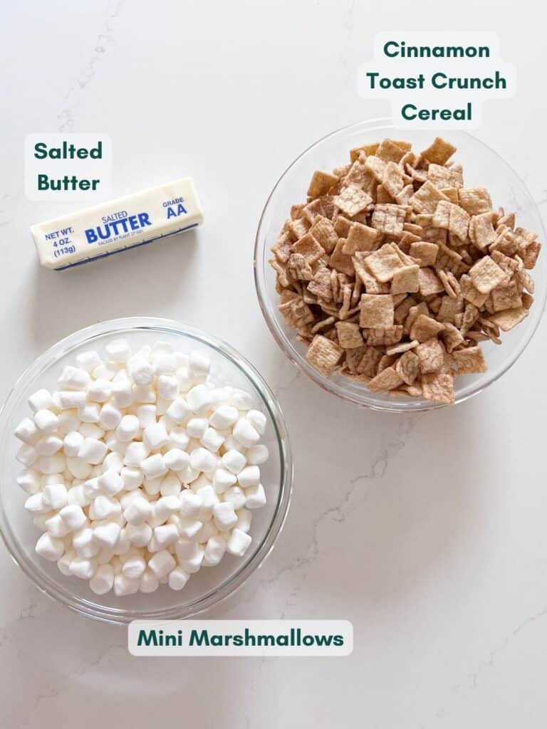 The ingredients for cinnamon toast crunch bars, labeled in glass bowls.