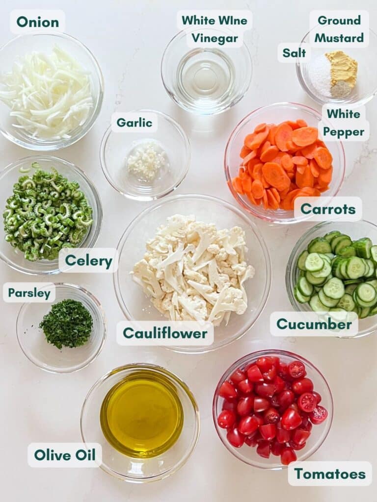 An overhead image of the labeled ingredients for this salad in glass bowls.