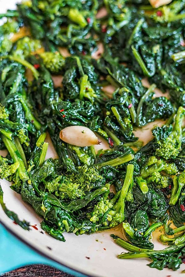 closeup: cooking broccoli rabe in a skillet