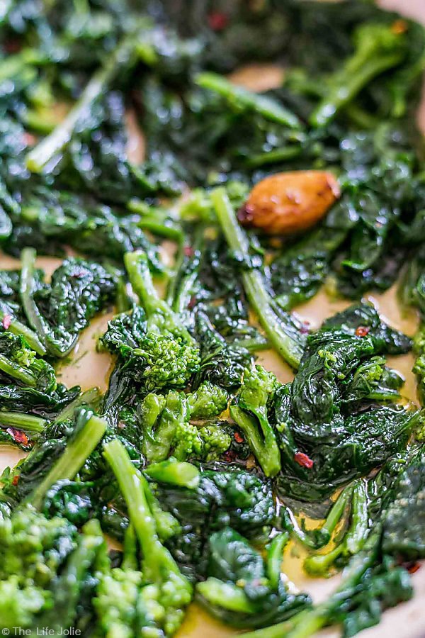 closeup: sautéed broccoli rabe with garlic in a sauté pan