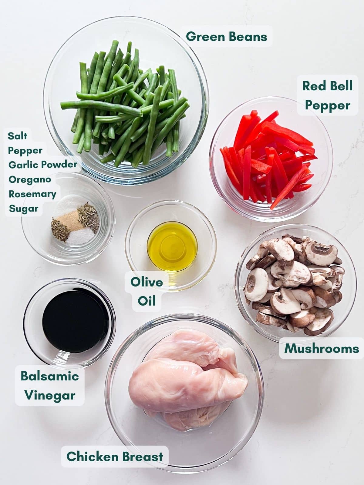 An overhead image of the ingredients labeled in glass bowls.