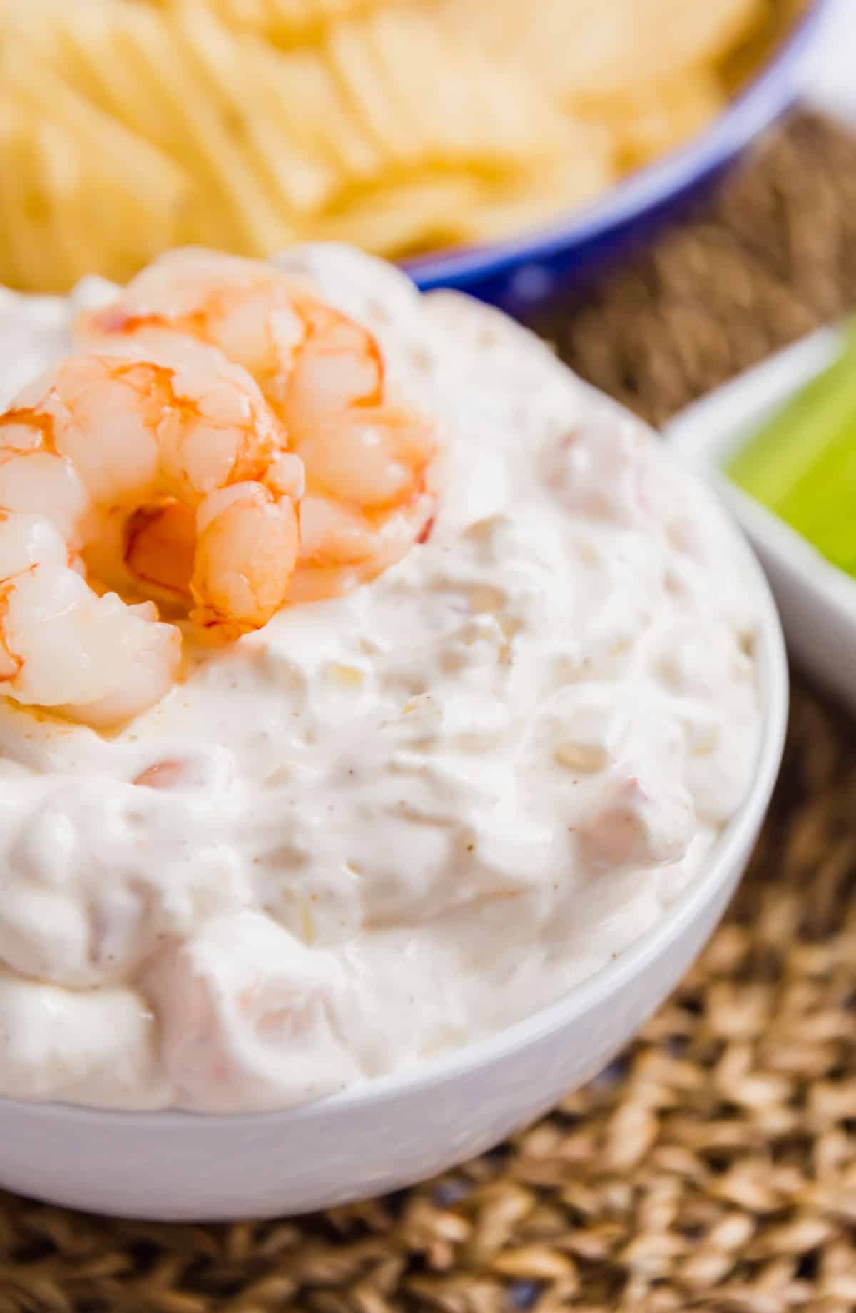 A very close up image of shrimp dip in a white bowl.