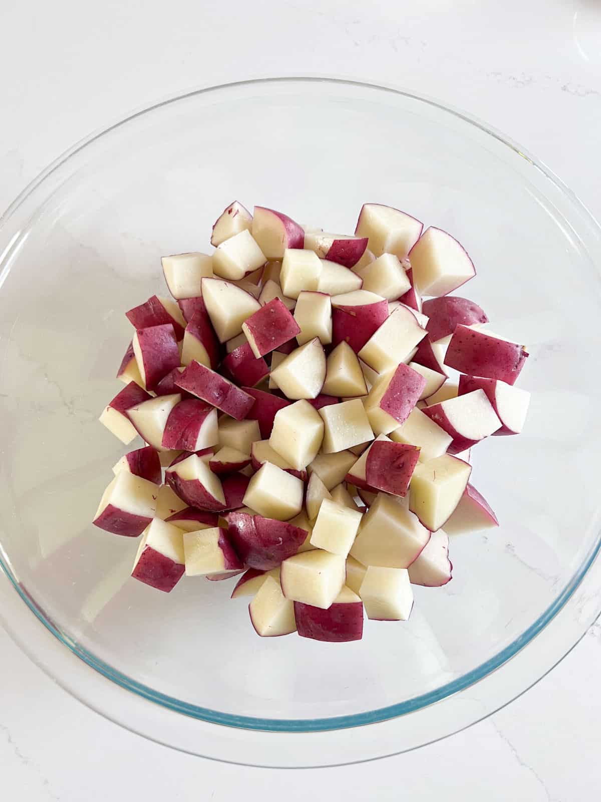 Diced red potatoes in a bowl.