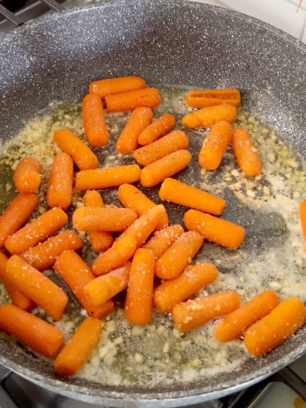 Carrots added to the how pan.