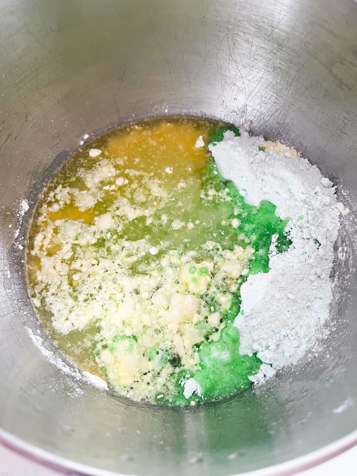Cake ingredients in a metal stand mixer bowl.