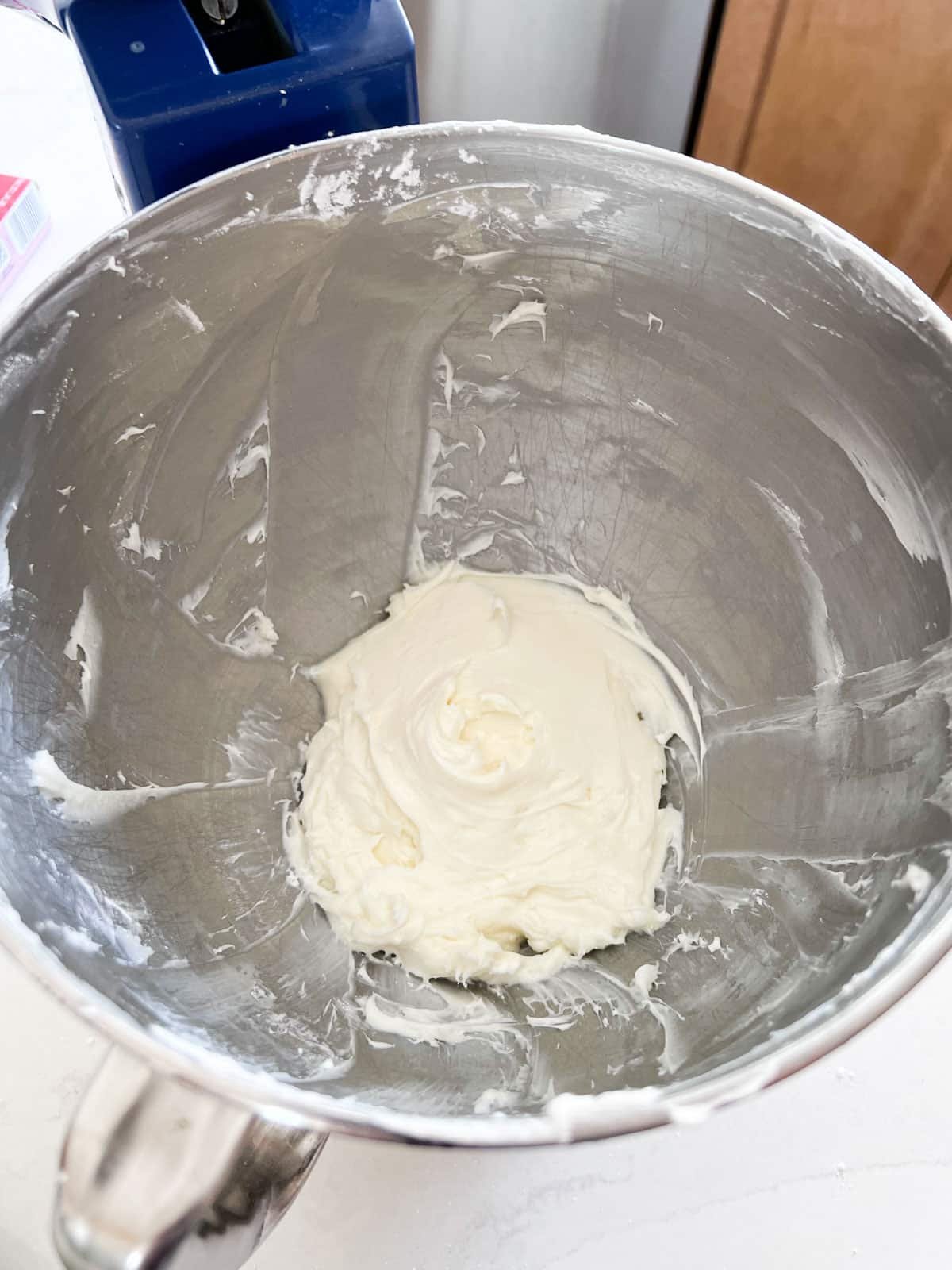 The cream cheese mixture whipped together and well combined in the stand mixer bowl.