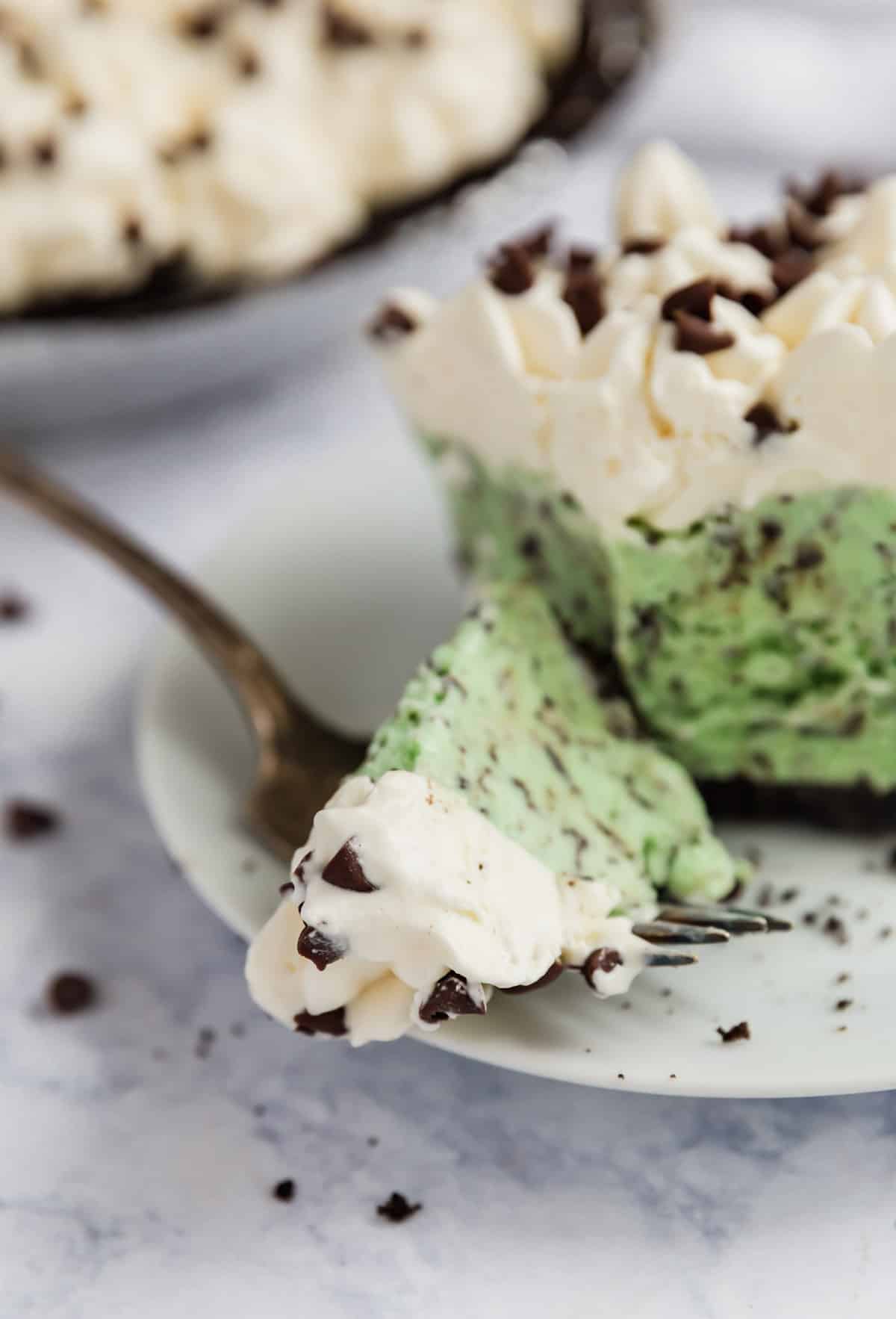 A close up of a bite of ice cream pie.