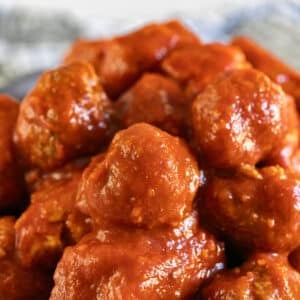 A pile of homemade meatballs in tomato sauce.