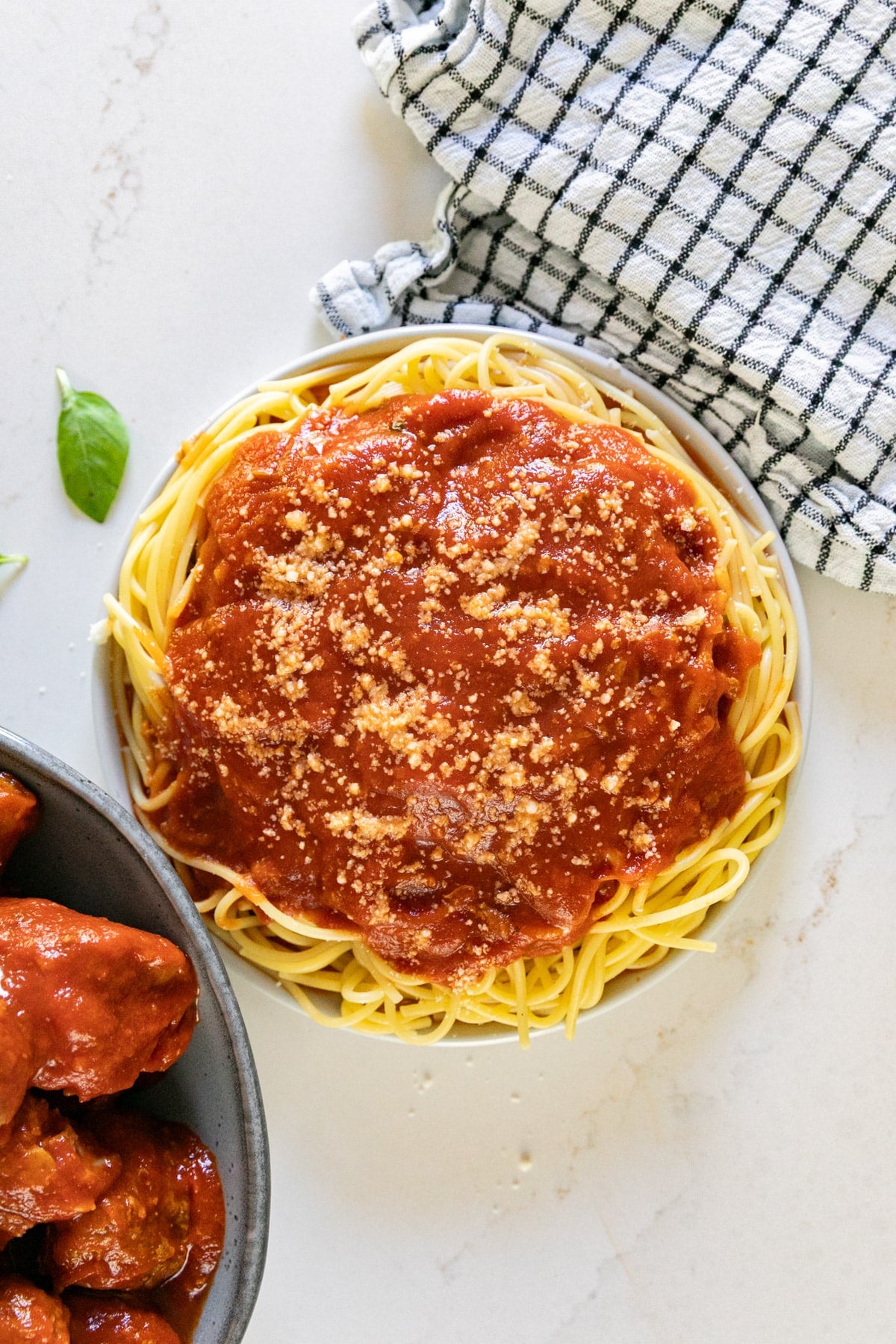 An overhead image of meat sauce on spaghetti.
