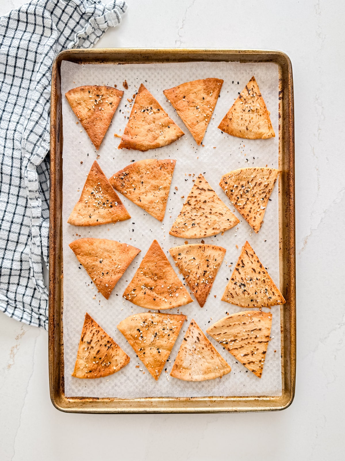 An overhead image of a pan of baked pita chips.