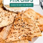 A close up of a pita chip onto top of other pita chips.