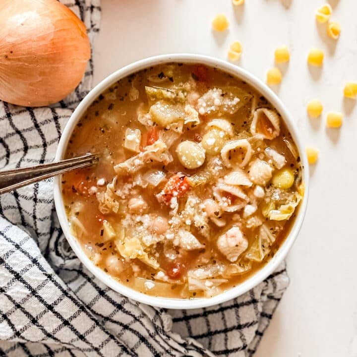 An overhead image of a bowl of minestrone soup.