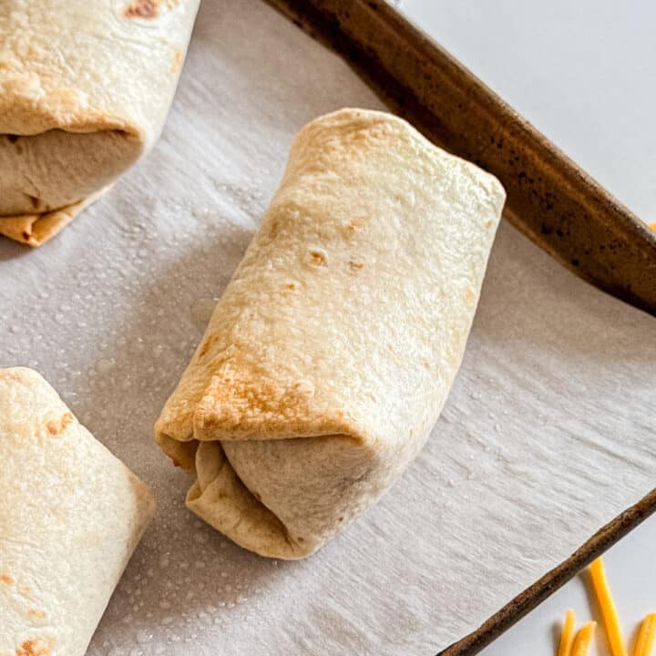 A bean burrito on a sheet pan.