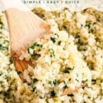A close up image of a wooden spoon holding a scoop of cilantro clime cauliflower rice.