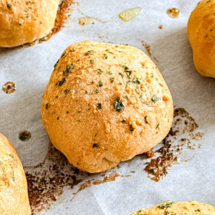 A close up image of a meat lovers pizza bite on a pan.