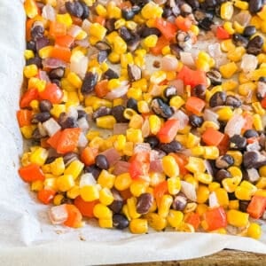 A close up image of the corner of the pan of corn salsa.