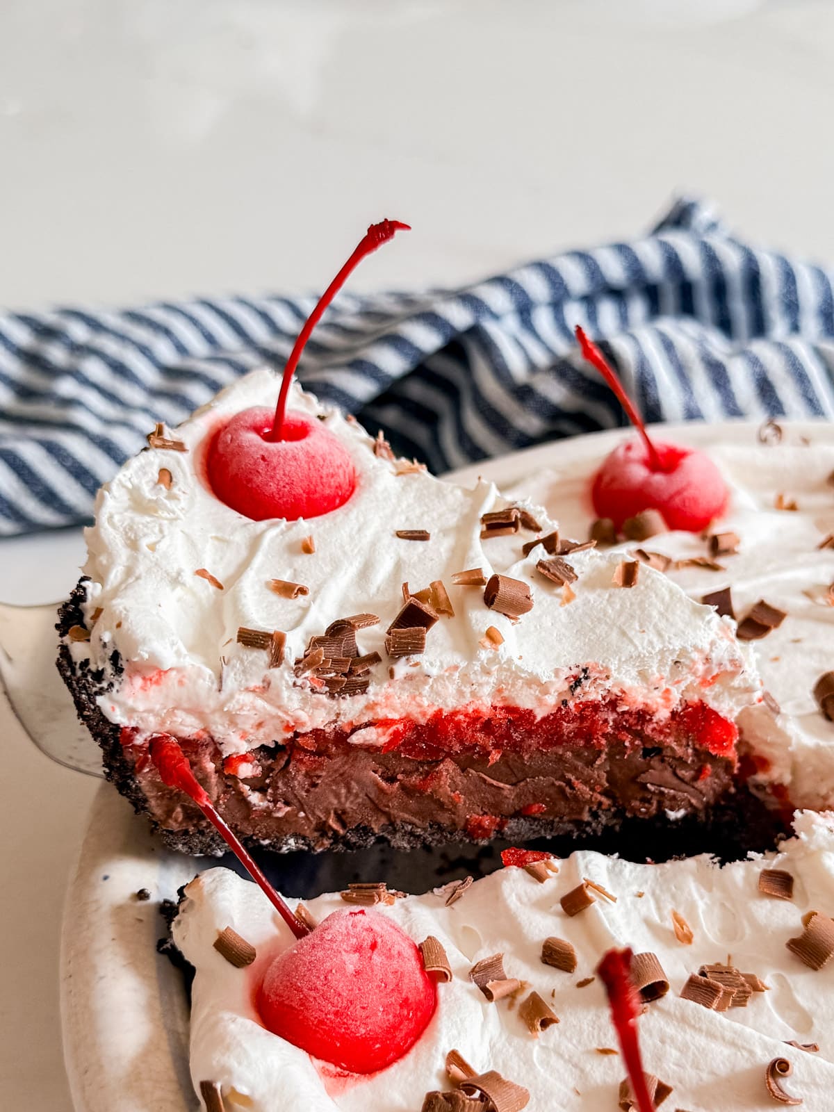 A slice of ice cream cake being lifted from the pan.