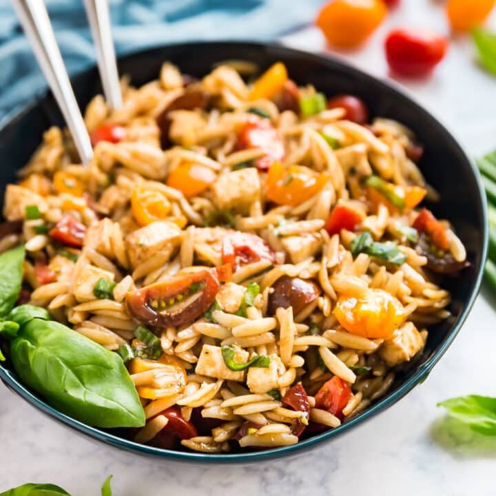 A bowl of caprese pasta salad.