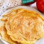 A close up image of apple pancakes recipe on a plate.