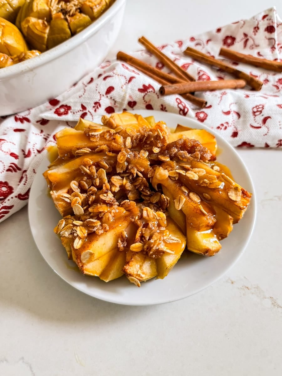 Bloomin' baked apple on a plate.