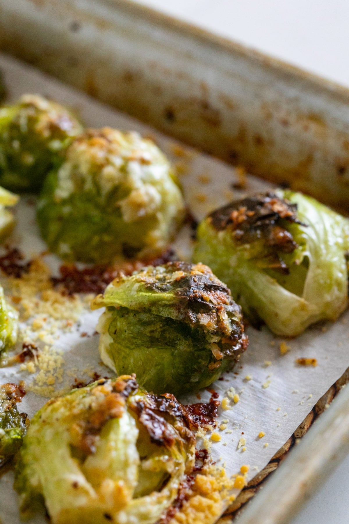 Perfectly browned Brussels sprouts on a sheet pan.